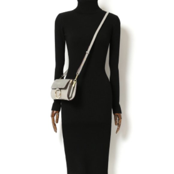 A hip-hugging knit base dress
